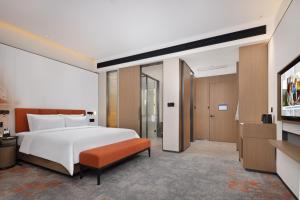 Postelja oz. postelje v sobi nastanitve Hampton by Hilton Dongguan Liaobu Songshan Lake Avenue