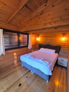 Кровать или кровати в номере Paşa Bungalov HOTEL