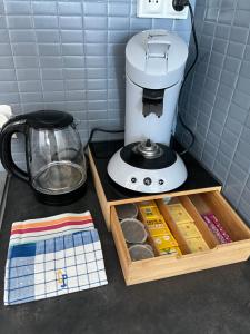 a coffee maker sitting on a counter next to a mixer at Vivez le Bonheur - Plage - Port de plaisance - Vue mer in Le Havre