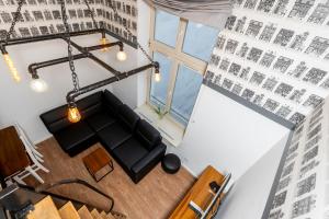 an overhead view of a living room with a couch at Starowiślna 36 Apartment with Mezzanine in Krakow