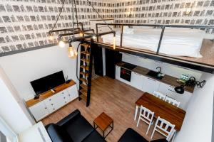 an overhead view of a room with a bed and a table at Starowiślna 36 Apartment with Mezzanine in Krakow