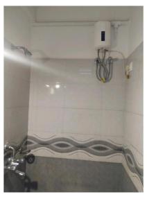 a bathroom with a sink and a toilet in a room at Hotel UK Palace Puri Near Sea Beach Best Seller in Puri