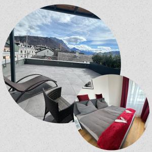 a room with a bed on a balcony at CityLake G23 Apartments in Gmunden