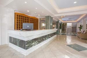 a lobby with a reception desk in a building at Achilleas Beach Hotel in Mastihari