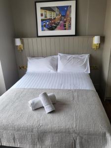 Postel nebo postele na pokoji v ubytování Urban Nest Townhouse