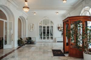 a large room with a lobby with a large door at Hôtel Le Royal Promenade des Anglais in Nice