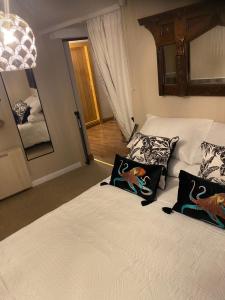a bedroom with two twin beds and a chandelier at The Lair in Whitby