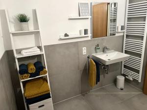 a small bathroom with a sink and a sink at Urlaub im Sonnendorf Burgberg in Burgberg