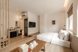 TV a/nebo společenská místnost v ubytování 河映宿沐 River Trees Hotel + 29 fotografií