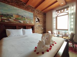 Postel nebo postele na pokoji v ubytování Durrat Nizwa Hotel