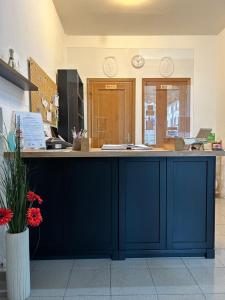 a large blue counter in a room with at Hotel Cecile in Pisa