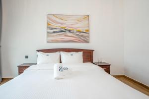 Ένα ή περισσότερα κρεβάτια σε δωμάτιο στο Deluxe 2BR Apartment Dubai Marina View