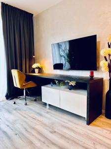 Een TV en/of entertainmentcenter bij The Rocks Apartment
