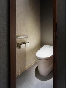 a bathroom with a toilet and two rolls of toilet paper at Mitsui Garden Hotel Gotanda - Tokyo in Tokyo