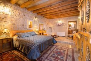 מיטה או מיטות בחדר ב-Cappadocia Acer Cave Hotel