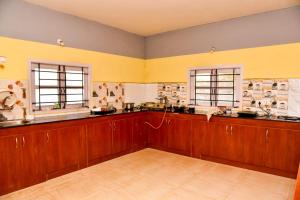 Kuchyň nebo kuchyňský kout v ubytování Phoenix View Stay Ooty