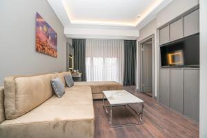 a living room with a couch and a table at 216 Style Suite in Istanbul
