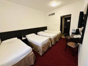 Postel nebo postele na pokoji v ubytování Miaad Al Majd Hotel