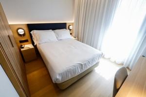 Postel nebo postele na pokoji v ubytování Hotel Zenit Bilbao