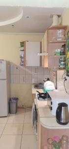a kitchen with a stove and a microwave in it at Kosher Hostel in Odesa +23 photos