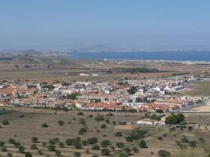 an aerial view of a town in a field at Adosado en planta baja in Los Belones