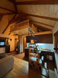 a living room with a loft with a staircase at Rudnicka vila in Arandelovac