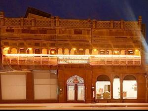 a building with a sign that reads hotel australian asylum withholding at Hotel Swagatam in Bikaner