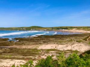 a view of a beach with the ocean at Montgomery Barn in Bideford