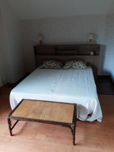 Postel nebo postele na pokoji v ubytování Le Clos Fleuri