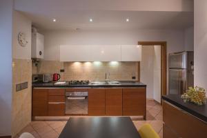 a kitchen with a sink and a counter top at Primopiano - Verdi in Sesto San Giovanni