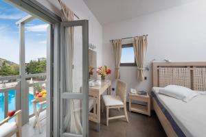 Postel nebo postele na pokoji v ubytování Hotel Nefeli + 37 fotografií