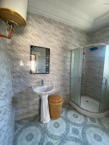 a bathroom with a sink and a shower at The Girls Guest house in Bathurst