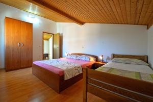 Postel nebo postele na pokoji v ubytování Apartments Goranka