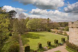 an aerial view of a garden with a castle at Shortflatt Tower in Longwitton