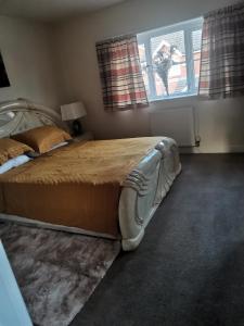 a bedroom with a bed and a window at Beautiful 1-Bed House in Manchester in Manchester