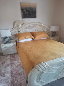 a bedroom with a large white bed with two pillows at Beautiful 1-Bed House in Manchester in Manchester