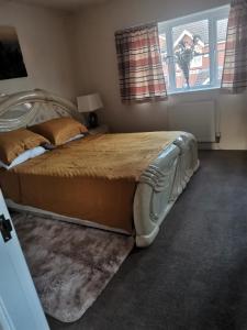 a bedroom with a large bed in a room at Beautiful 1-Bed House in Manchester in Manchester