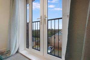 a view from a room with a window at Gravesend 2 Bed Apartment-2 minutes walk from shops, Restaurants and Motorway. Sleep upto 5 in Northfleet