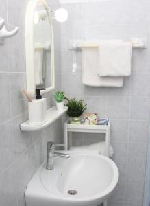 Kúpeľňa v ubytovaní Cozy Flat at Regina Apartments