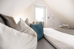 Postel nebo postele na pokoji v ubytování Baltic House Penthousewohnung Seebrücke