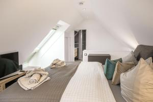 Postel nebo postele na pokoji v ubytování Baltic House Penthousewohnung Seebrücke