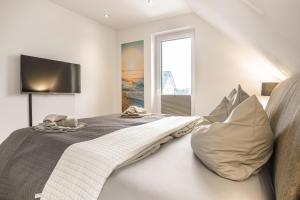 Postel nebo postele na pokoji v ubytování Baltic House Penthousewohnung Seebrücke