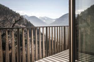 a balcony with a view of the mountains at Picea am Ötzerhof 1 in Merano