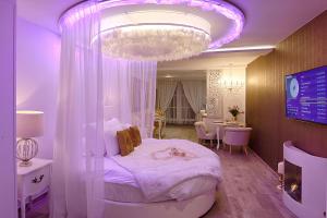 Ένα ή περισσότερα κρεβάτια σε δωμάτιο στο Le Clos des Thermes +123 φωτογραφίες
