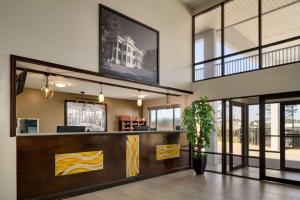 a lobby of a restaurant with a reception desk at Super 8 by Wyndham Biloxi Ocean Springs in Ocean Springs