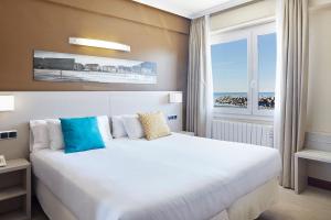 Postel nebo postele na pokoji v ubytování Hotel Parma