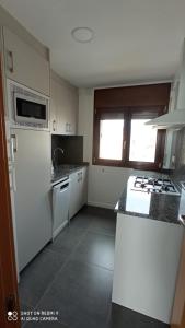 Kuchyňa alebo kuchynka v ubytovaní Miami APARTAMENTO CORI