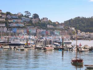 a bunch of boats docked in a marina with houses at 2 The Stables in Dartmouth