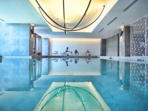 a pool in a house with a large swimming pool at Novotel Convention And Spa in Antananarivo