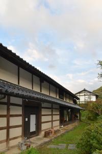 a large house with a building at sabouしが in Matsumoto
